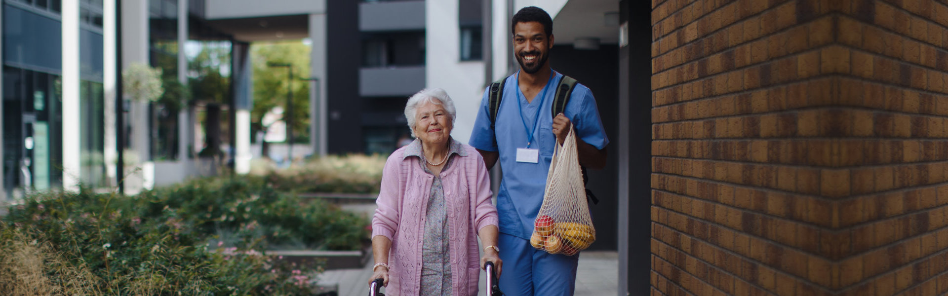 nurse and elder walking